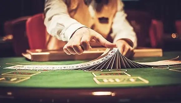 result oregon Dream Gaming blackjack table with card shoes and betting chips visible